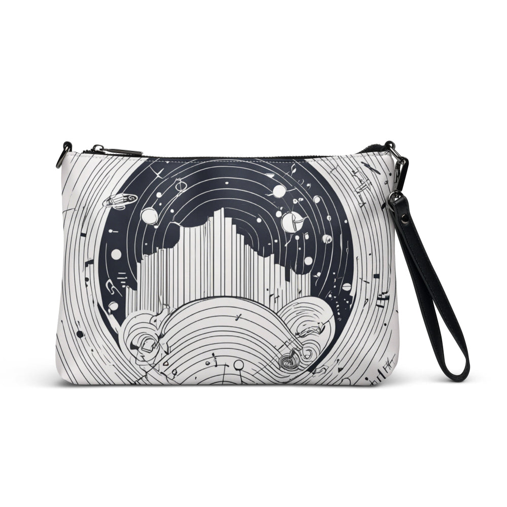 A black-and-white crossbody bag featuring an abstract celestial-inspired design with circular and linear patterns, black strap, and a modern aesthetic—perfect for everyday style and statement looks