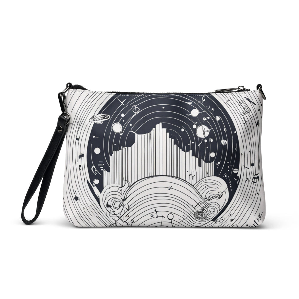 A sleek black-and-white crossbody bag featuring an abstract cosmic-inspired design with circular shapes, fine lines, and dot accents, complemented by a black adjustable strap—perfect for stylish everyday wear