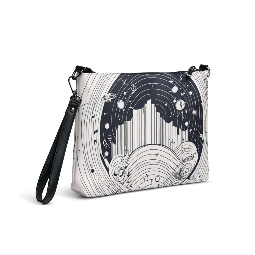 A sleek black-and-white crossbody bag featuring an abstract design with circular shapes, fine lines, and celestial-inspired accents, complemented by a black strap—perfect for stylish everyday wear